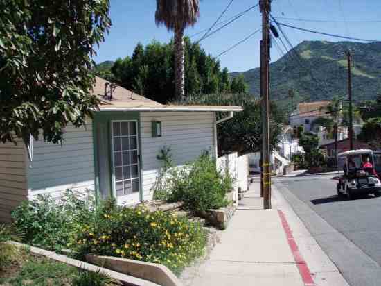 The home's front entrance is already planted with low-water landscaping.